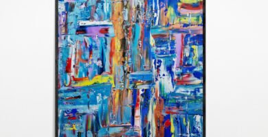 Artwork on Display (Standalone): "Kaled: A unique abstract painting showcasing vibrant multicolored layers and intricate palette knife strokes, framed and illuminated on a gallery wall