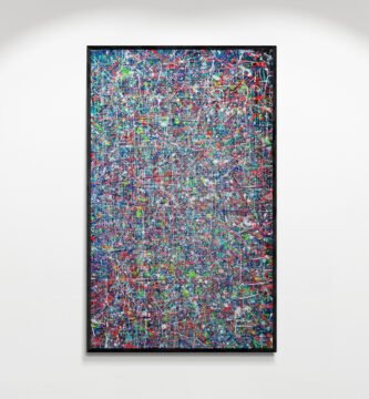 Kross artwork displayed in a modern gallery setting, showcasing dynamic Pollock-inspired lines and vibrant splashes on canvas