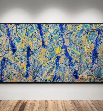 Abstract drip painting titled 'Number 11' displayed in a modern gallery setting, featuring dynamic splashes of blue, yellow, and green over a vibrant backdrop