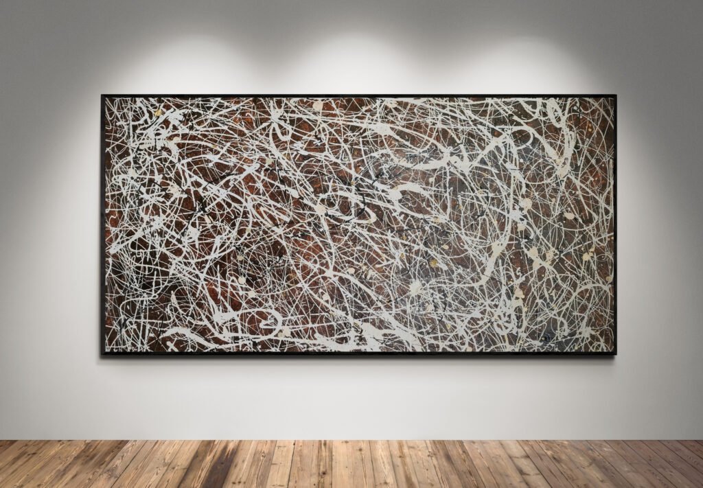 Number 15 – Jackson Pollock Style Brown Abstract Canvas displayed under spotlights, highlighting its elegant white, sand, and black splashes over a brown background