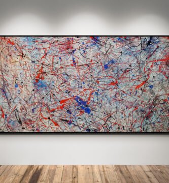Number 20, Jackson Pollock Inspired Red and Blue Abstract Canvas displayed in a modern gallery with spotlights