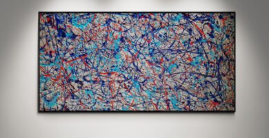 Number 21 – Jackson Pollock Style abstract painting featuring Martini Racing colors with bold strokes of blue, red, and silver on a textured canvas