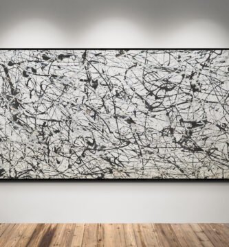 Number 7, a monochrome Jackson Pollock Style abstract canvas, showcasing bold black, gray, and silver splashes on a white background, displayed in a minimalist gallery setting