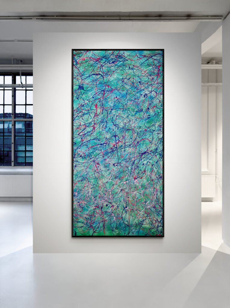 Vertical framed abstract painting in tropical colors, mounted on a clean gallery wall with natural light streaming in