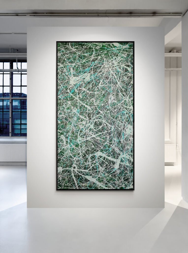 The 'Number 35' artwork, featuring a green abstract design in Jackson Pollock's style, mounted vertically in a modern gallery space with large industrial windows