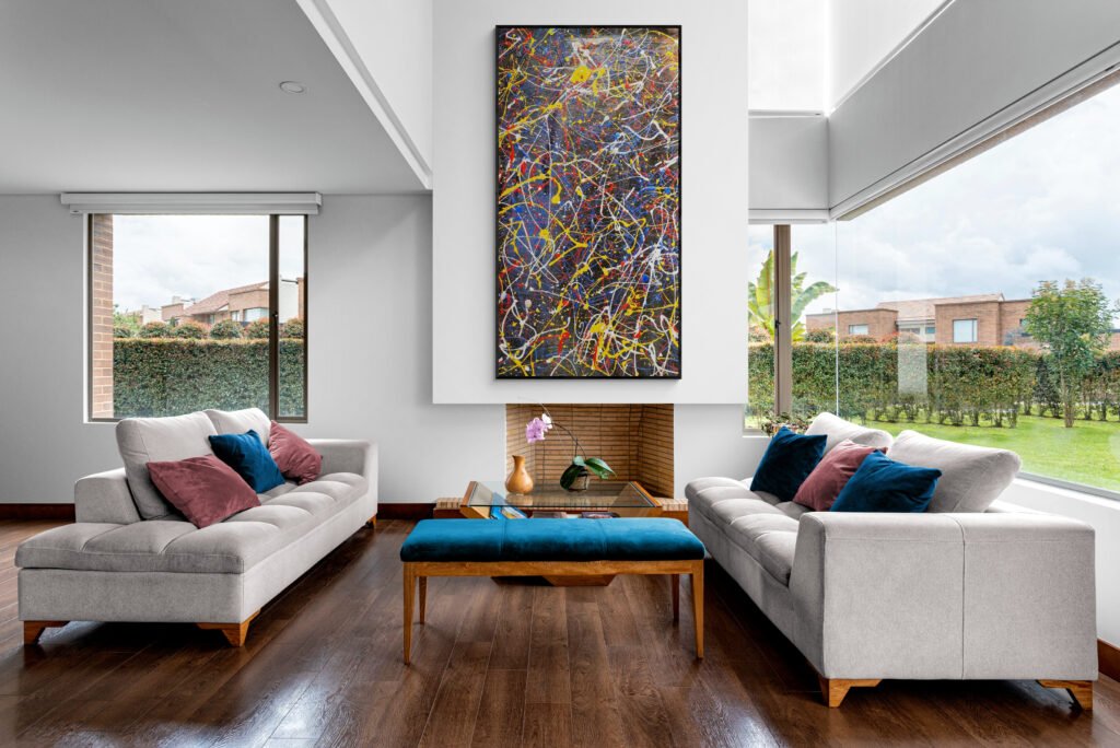 Number 45 – Abstract artwork mounted in a luxurious living room with large windows overlooking a garden, complementing the modern decor