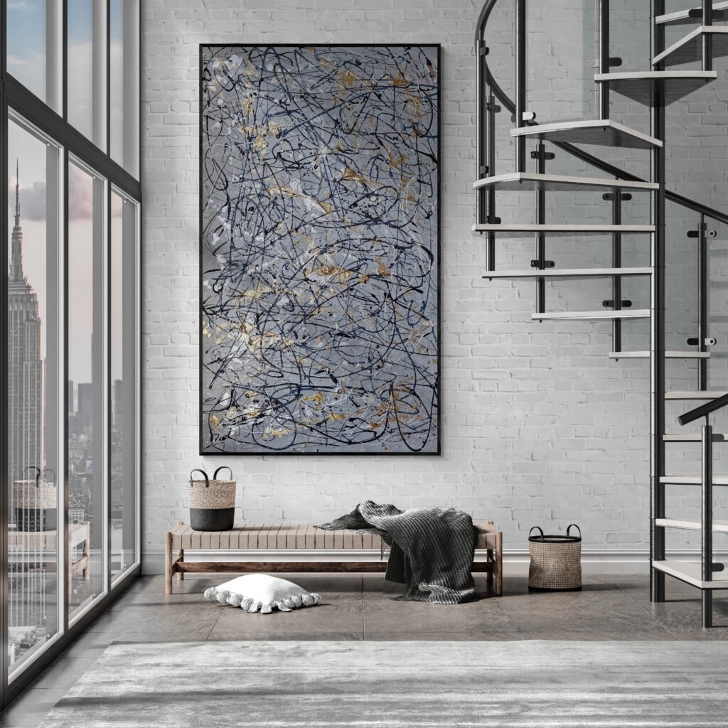 Number 10 hanging in an industrial-style living room with a staircase, bringing a bold artistic focus to the space