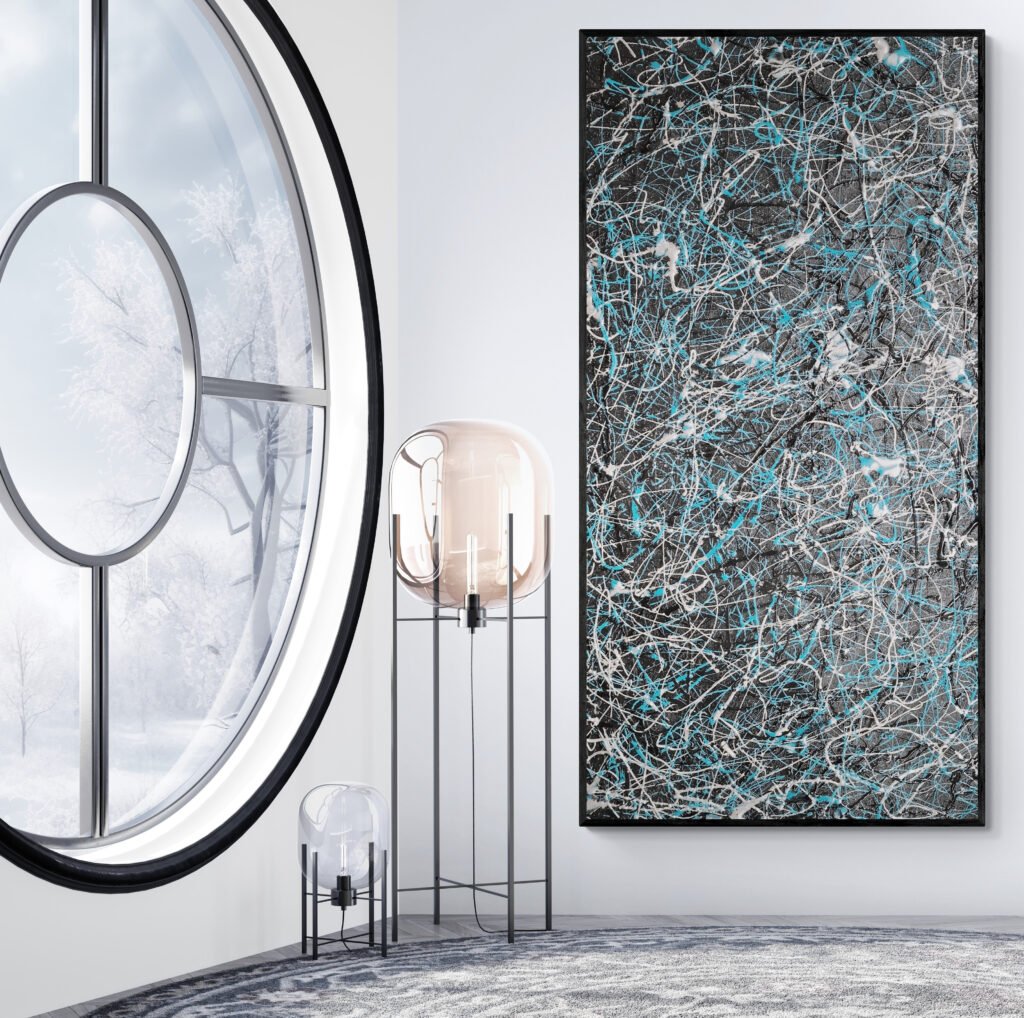 Number 27 framed next to a round window in a bright interior, highlighting its abstract black and turquoise design in a modern space