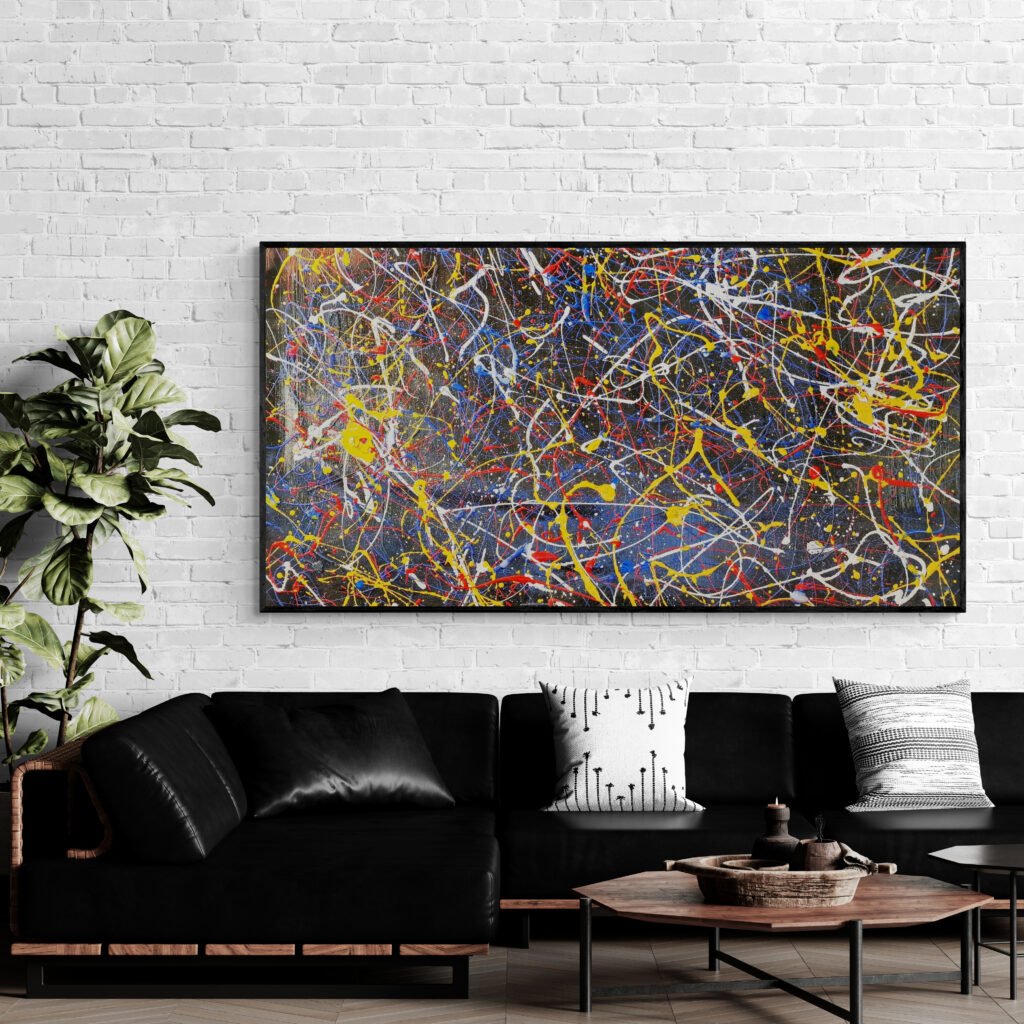 Number 45 – Abstract art mounted above a sleek black leather corner sofa in a lounge with a brick accent wall and decorative pillows