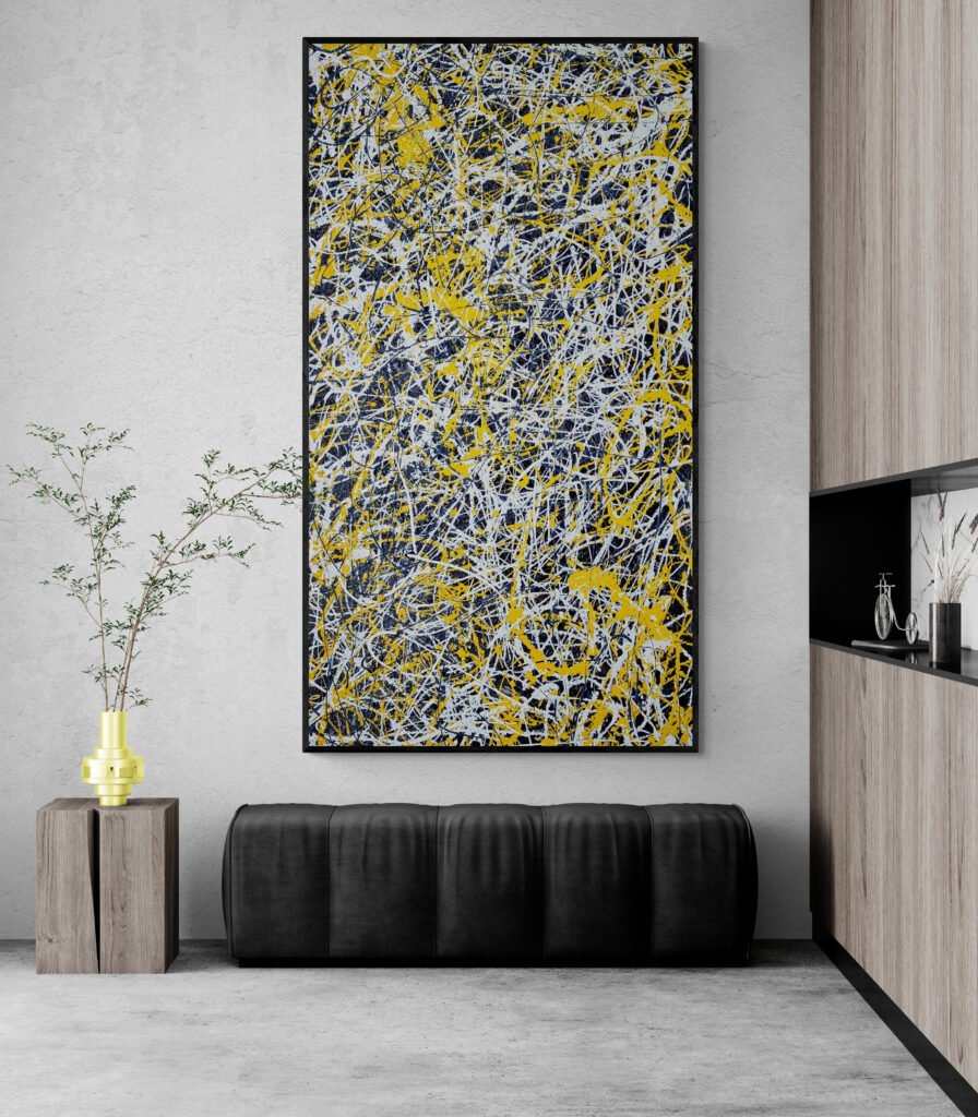 Tall Jackson Pollock-inspired painting with vibrant yellow and white patterns, displayed in a minimalist interior with a black bench and decorative vase