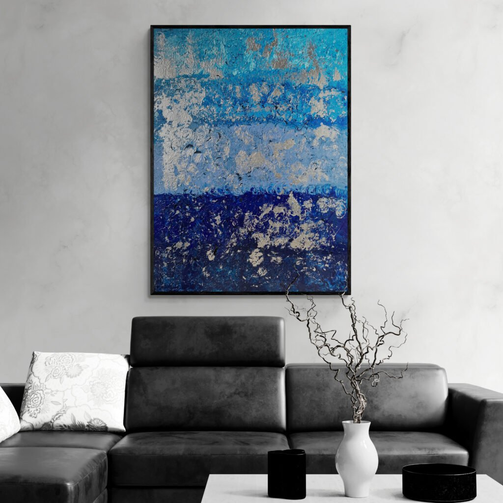 Blur abstract painting hanging in a stylish living room with a sleek black leather sofa and minimalist decor