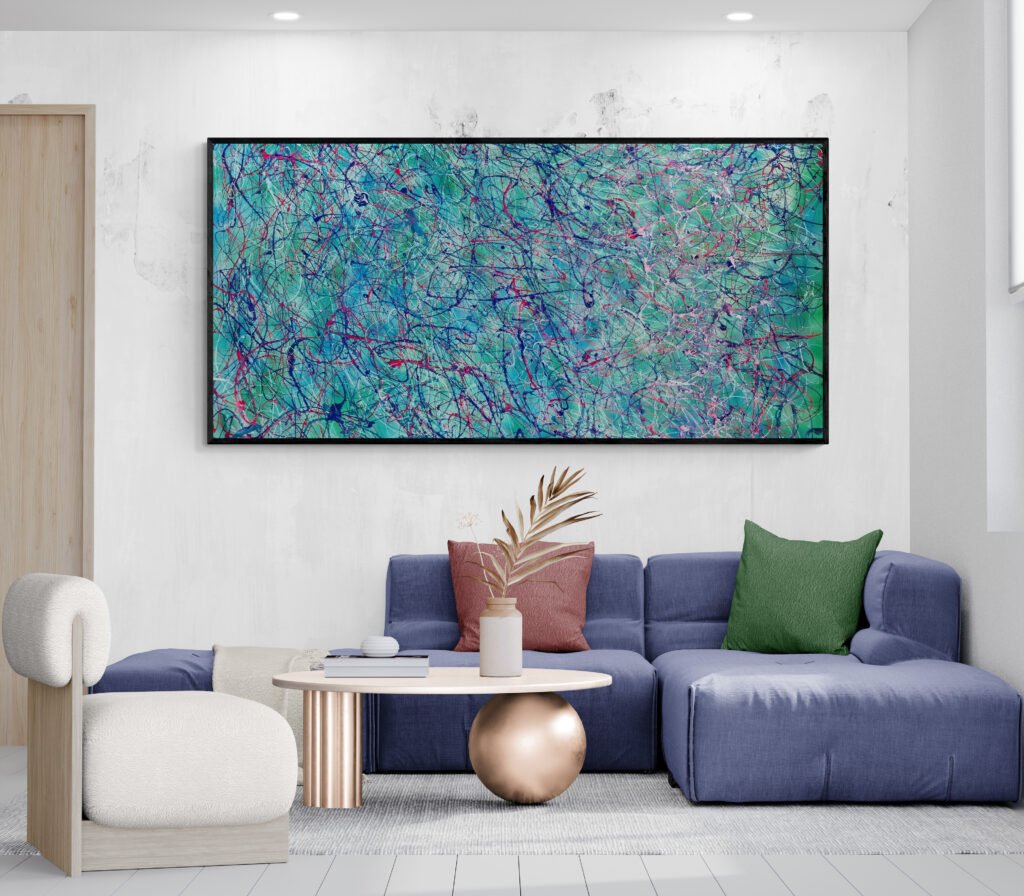 Unique abstract artwork in tropical colors, positioned over a modern coffee table and sofa in a cozy living space