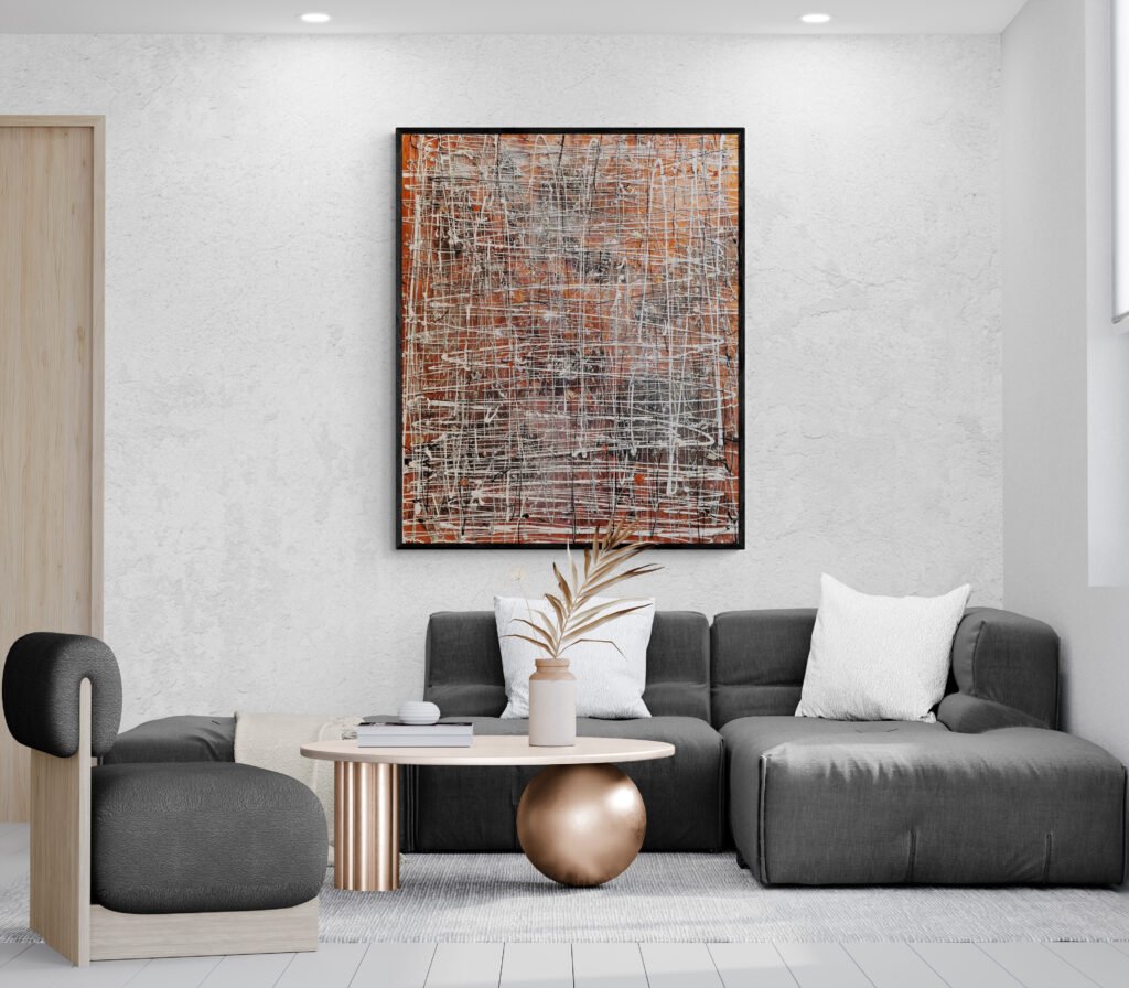 The artwork adds an artistic touch to a space with a gray sectional sofa, a unique coffee table, and minimalist decor