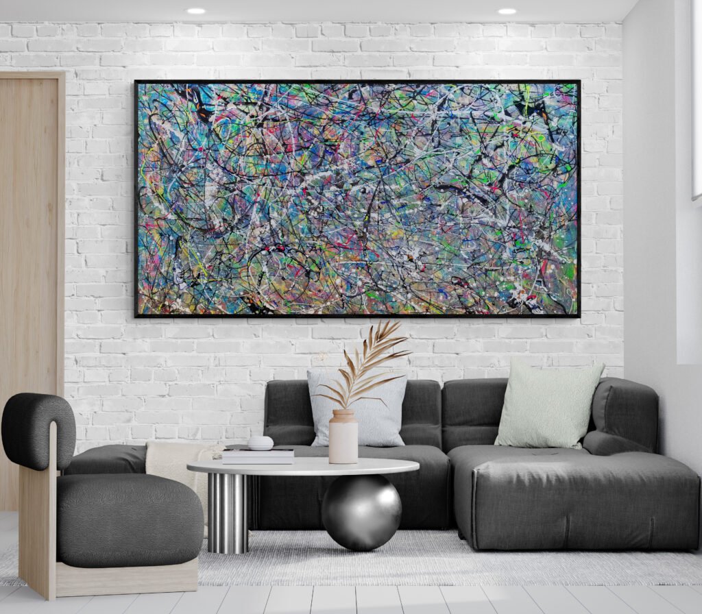 Number 90 - Vibrant Artwork in a Contemporary Living Room: A horizontal Pollock-inspired abstract painting with vivid colors hung above a sleek gray sofa in a minimalist living room with a white brick wall