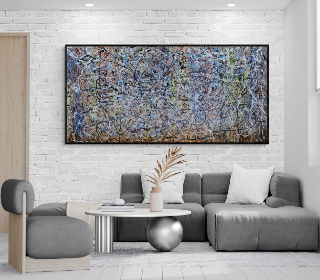 Abstract painting hung above a stylish gray sofa in a modern living room with minimalist decor and a unique coffee table