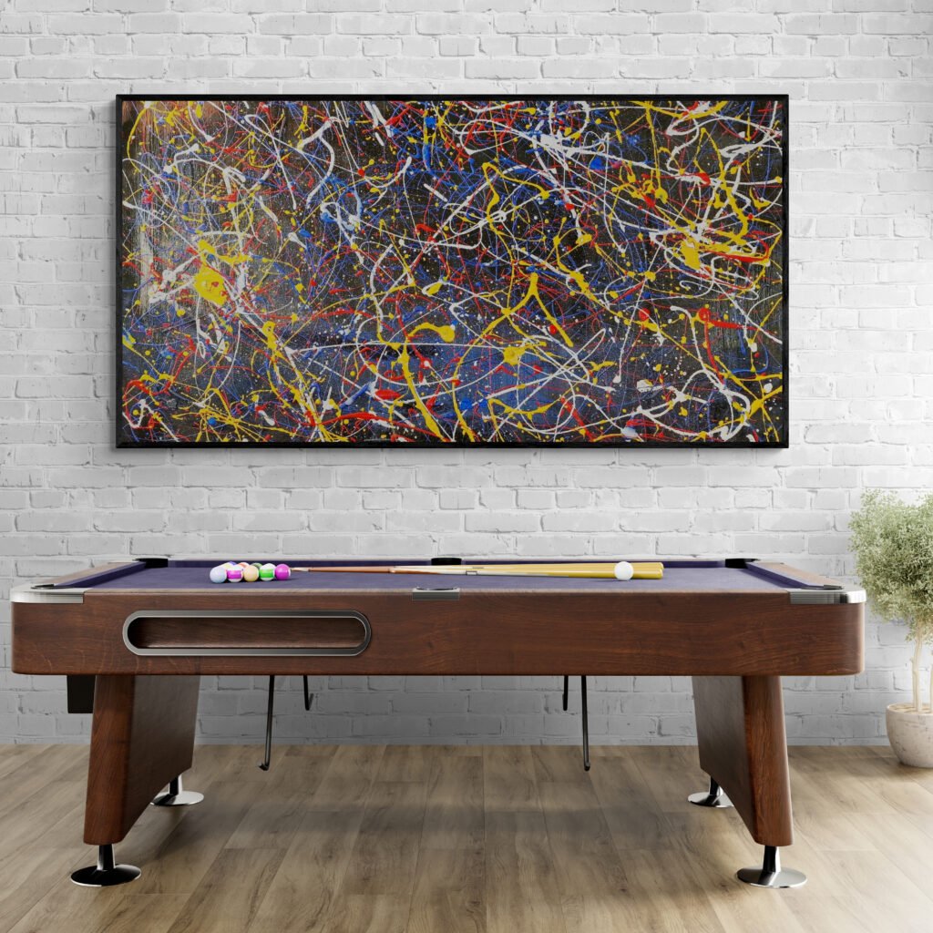 Number 45 – Vibrant abstract art showcased above a pool table in a recreation room with a brick wall and wooden floors