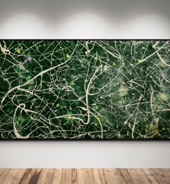 Gallery-style spotlight view of ‘Number 63’, a large green Jackson Pollock inspired drip painting with dynamic ivory, silver, and lime accents.