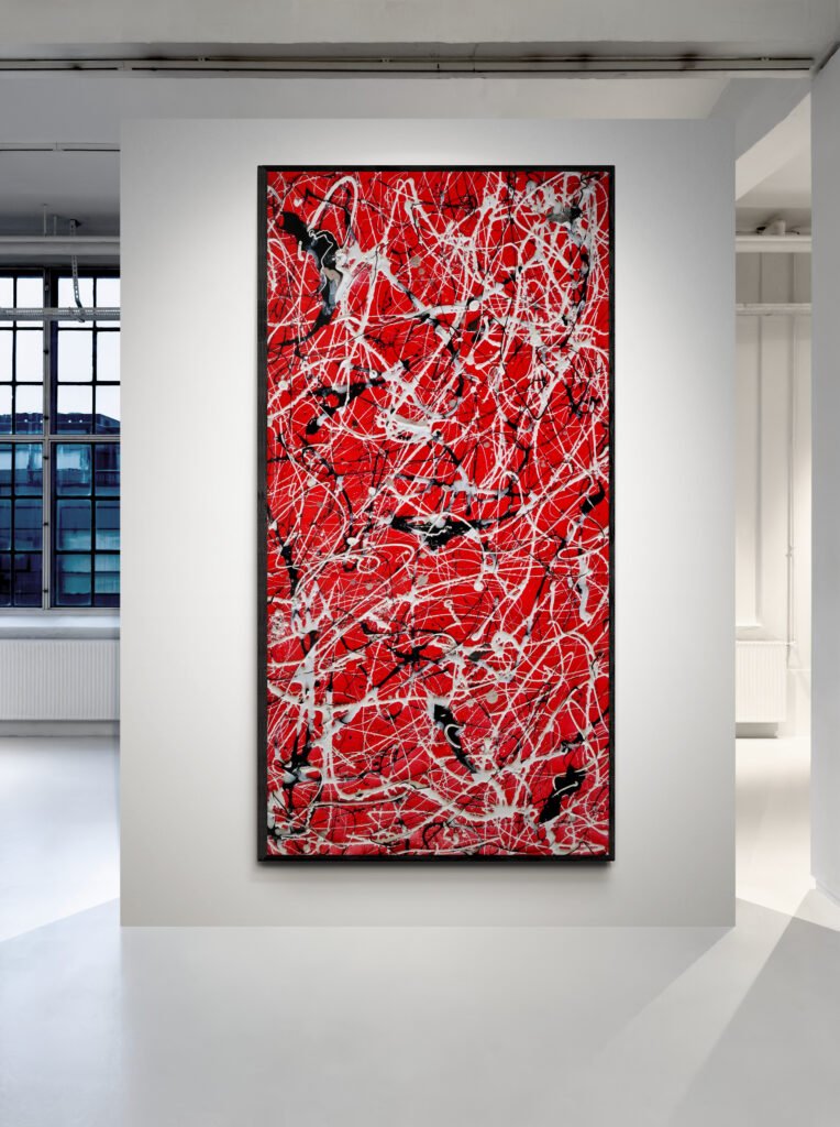 Vertical red abstract canvas with dynamic drip textures displayed in a contemporary art gallery with industrial windows.