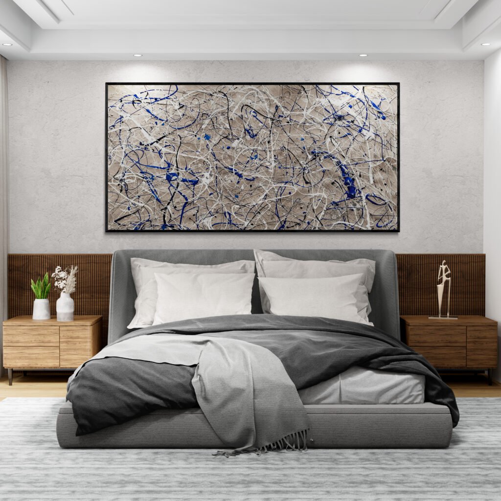 Oversized abstract drip painting in neutral sand and vibrant blue colors, hanging above a luxury bed in a minimalist bedroom setting.