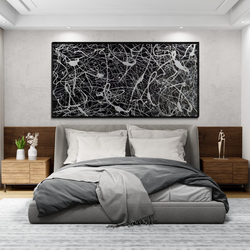 "Number 77" black and white abstract canvas over bed in a contemporary minimalist bedroom interior