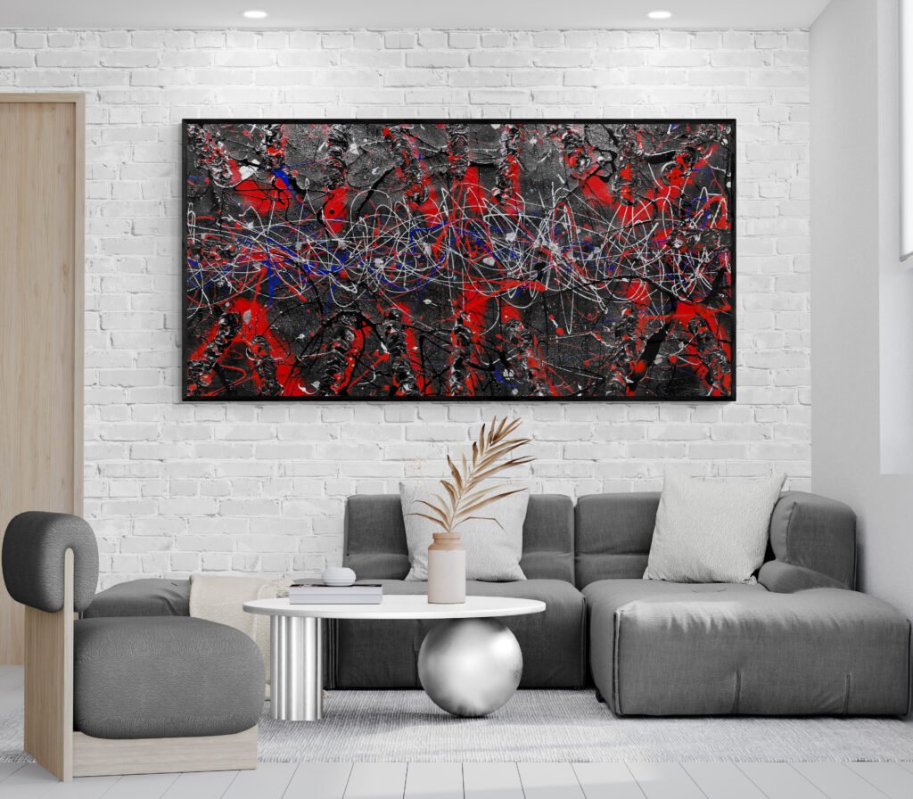 Horizontal Jackson Pollock style painting Number 66 on a white brick wall above a gray modular sofa in a cozy living room setting.
