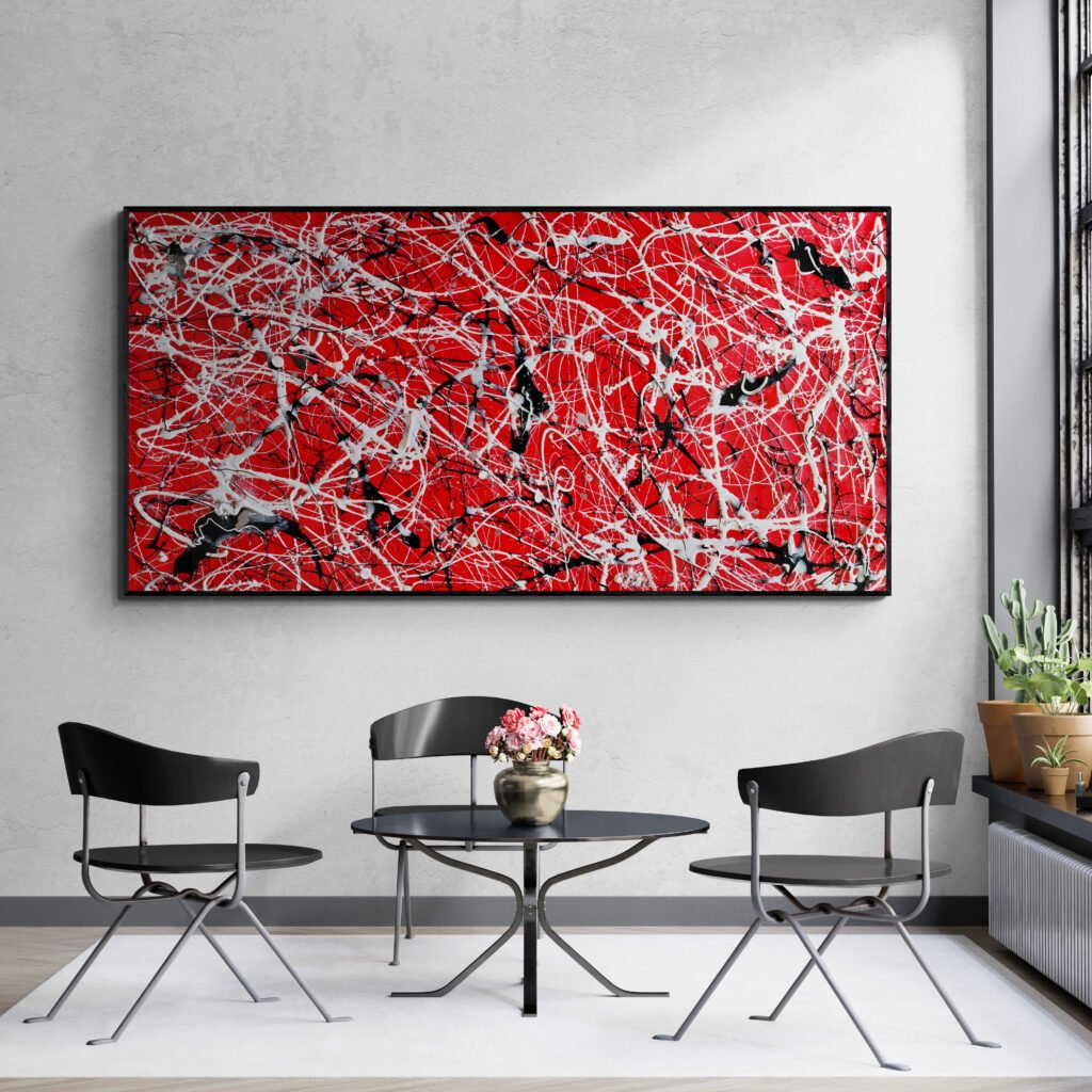 Bold red Jackson Pollock-style abstract painting displayed above a black round table in a modern lounge with minimalist chairs.