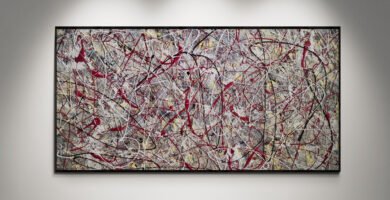 Abstract artwork Number 34 in Jackson Pollock style with textured grey background and black and red splashes | A bold symphony of contrast and movement