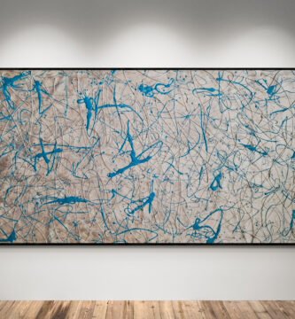 Abstract artwork Number 76 in Jackson Pollock style with metallic silver background and turquoise splashes | A luminous and modern composition of rhythm and energy