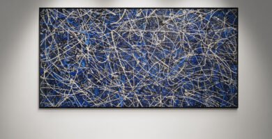Abstract artwork Number 84 in Jackson Pollock style with deep blue background and silver splashes | A serene and elegant composition of balance and motion