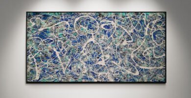 Abstract artwork Number 74 in Jackson Pollock style with emerald green, blue, and silver splashes on a grey base | A luminous composition of depth and balance