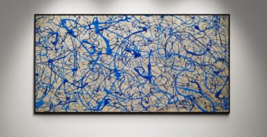 Abstract artwork Number 75 in Jackson Pollock style with ocean blue, turquoise, and metallic silver splashes on a pewter background | A fluid and modern composition of depth and light