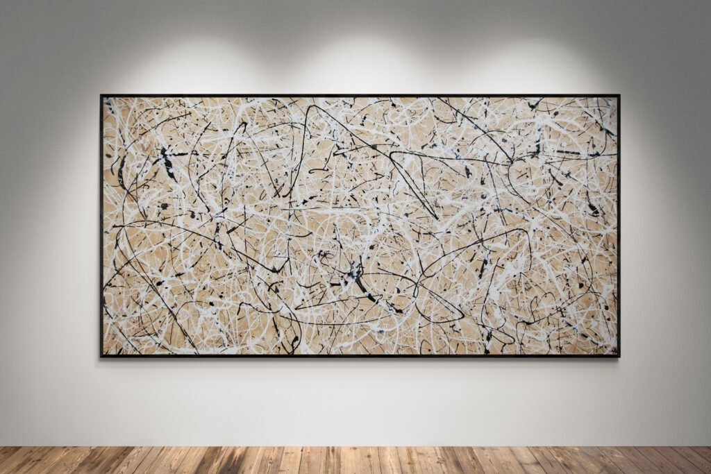 Abstract artwork Number 44 in Jackson Pollock style with sand-colored background and white, black, and silver splashes | A minimalist composition of balance and light