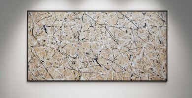 Abstract artwork Number 44 in Jackson Pollock style with sand-colored background and white, black, and silver splashes | A minimalist composition of balance and light