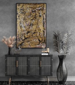 vertical gold and black Jackson Pollock style abstract wall art in contemporary entryway with decorative console