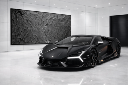 large black Jackson Pollock style abstract wall art with textured finish in modern luxury car showroom interior