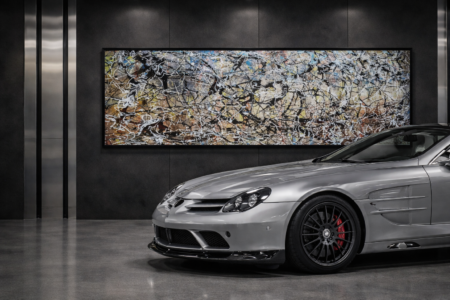 Jackson Pollock style multicolor abstract painting in luxury garage with sports car interior